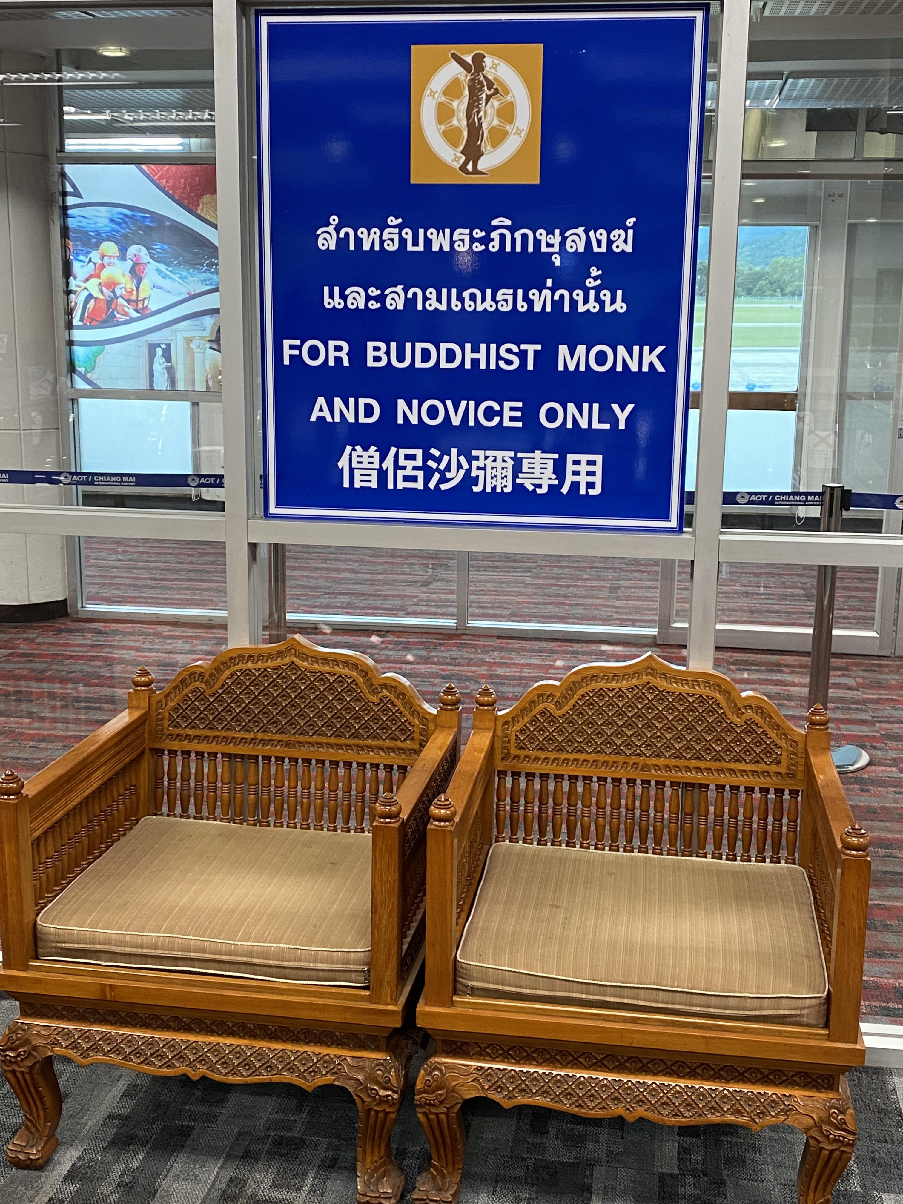 Buddhist monks get special seats at Thai airports, apparently.