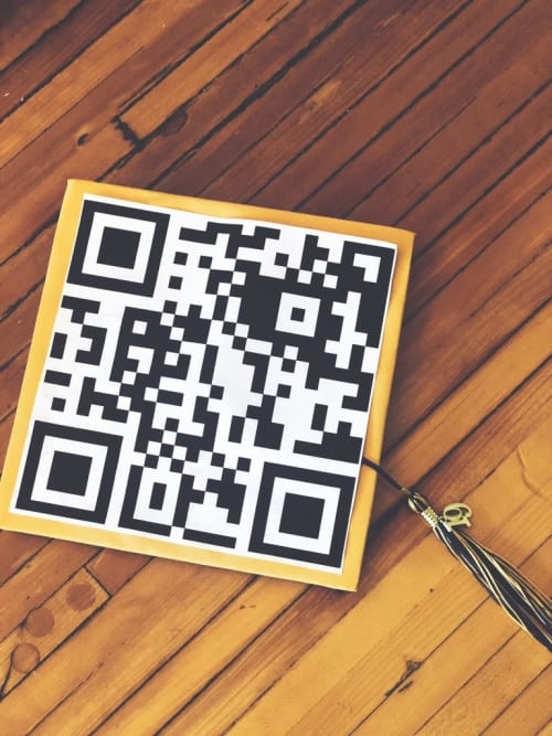 One student decorated their graduation cap with a giant QR code that directs people to a list of students killed in school shootings.