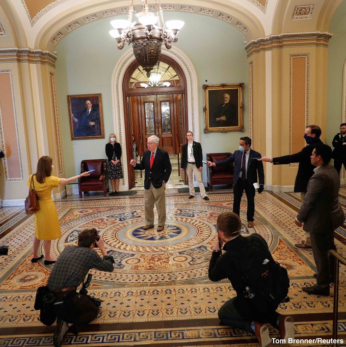 Seven Ministry of Magic wizards trying to cast spells on Mitch McConnell