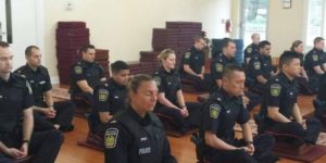 Canadian police officers meditating before they start their day