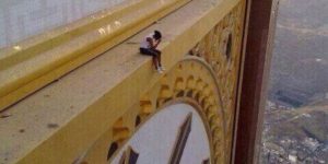 A Woman Sitting On The Abraj Al-Bait, circa Mecca.