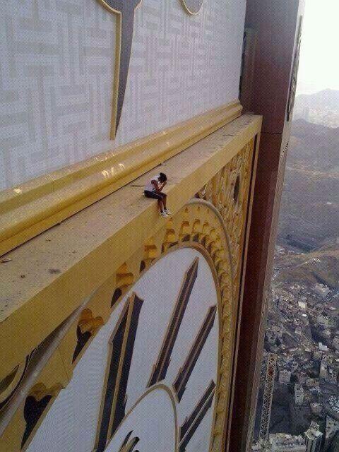 A Woman Sitting On The Abraj Al-Bait, circa Mecca.