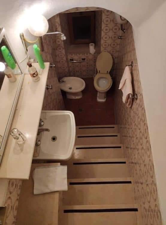 This staircase bathroom is actually pretty neat.