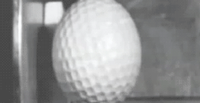 A golf ball hitting steel in slow motion.