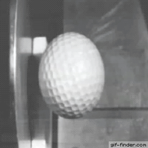 A golf ball hitting steel in slow motion.
