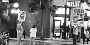 His sign may be smaller, but his message is much bigger.