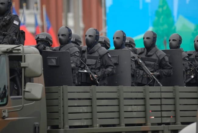 Taiwan Special Forces with bullet proof face masks look like they take sample c-19 pretty serious.