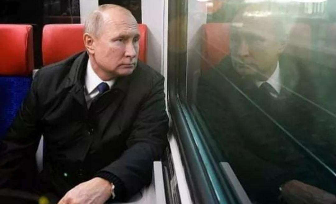 A picture of the President of Russia looking at the next President of Russia