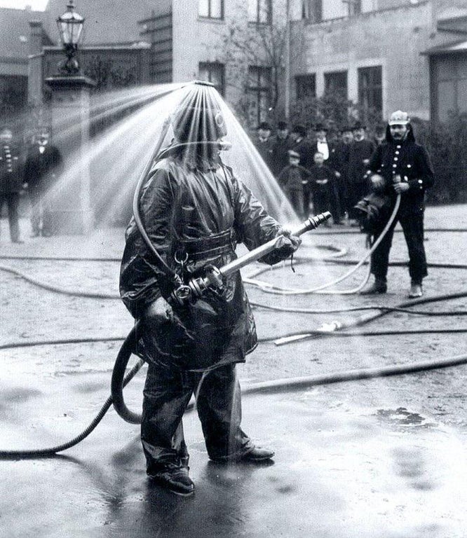 Testing helmets for firefighters, circa Germany 1900.