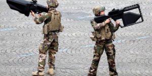 French soldiers shouldering anti-drone weaponry.