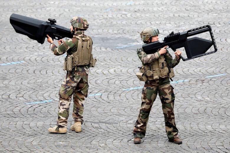 French soldiers shouldering anti-drone weaponry.