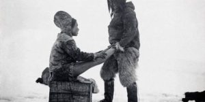 The Inuit man from Greenland warms the wife’s feet, circa 1891.