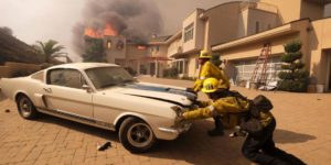 Firefighters saving a classic car from the California wildfires