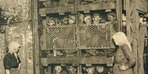 Belgium coal miners in a shaft elevator.