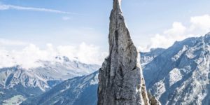 Guy does a flagpole on La Fiamma, circa Albigna, Switzerland