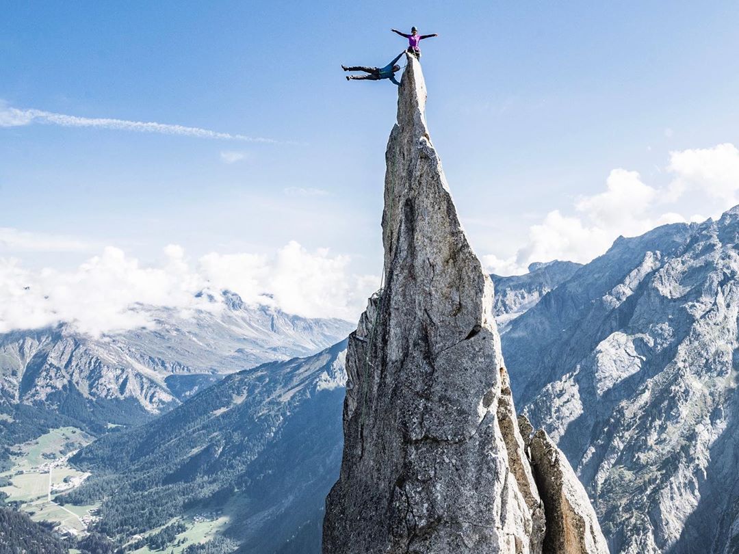 Guy does a flagpole on La Fiamma, circa Albigna, Switzerland