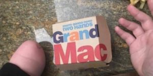 You need 2 hands to eat a Grand Mac according to Mcdonalds
