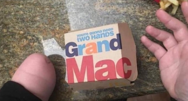 You need 2 hands to eat a Grand Mac according to Mcdonalds