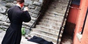 Ordained Exorcists snapping photos at The Exorcist steps.