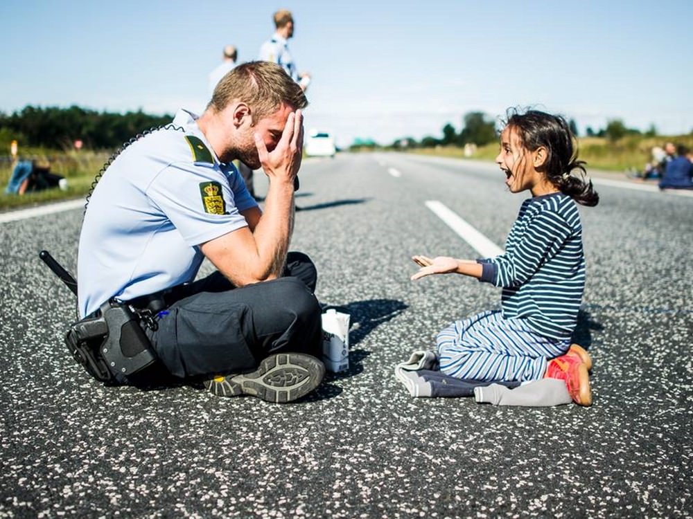 Danish police officer versus Syrian refugee